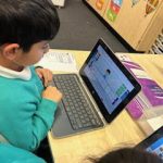 Student using a laptop.